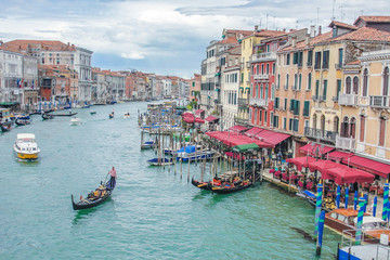 Fototapeta na wymiar View of Venice city and gondolas in the Grand Canal in Italy