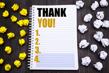Conceptual hand writing text caption showing Thank You. Business concept for Thanks Message Written on notepad note notebook book wooden background with sticky folded yellow and white