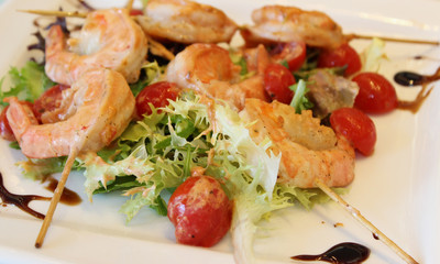 royal prawns with cherry tomatoes and greens