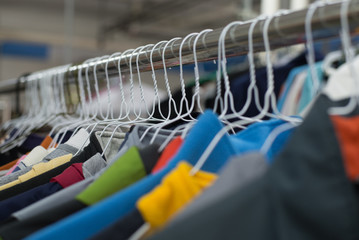 shirts hanging on a hanger.Colorful T Shirt