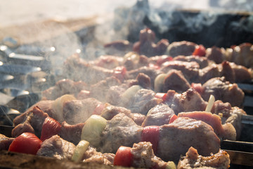 grilled meat cooked in BBQ on sunny winter day