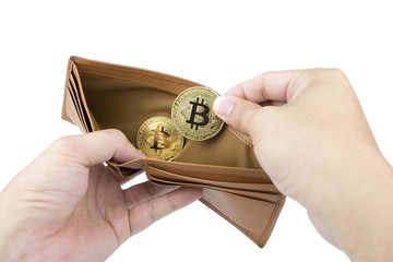 Fototapeta premium Bitcoin. Man hand holding gold bitcoin and brown wallet on isolated background