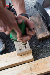 man worker working with an electric drill