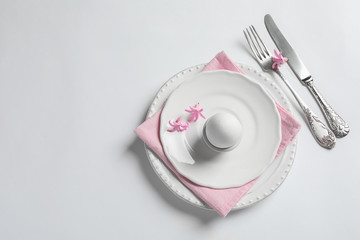 Beautiful festive Easter table setting on white background