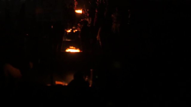 Fire pits on the beach at night in California. 