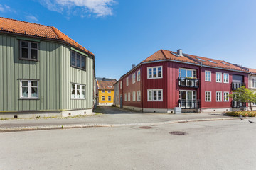 Fototapeta na wymiar Colorful buildings on streets of Trondheim, Norway. Scandinavian style of architecture.