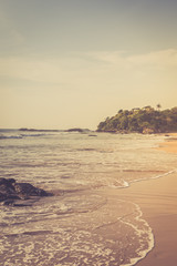 Fototapeta na wymiar Tropical beach. Beautiful landscape of Indian ocean, Sri Lanka. Toning photo
