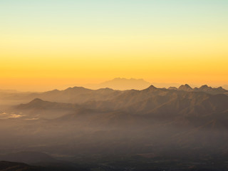 The sun rises on the top of the hill