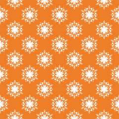 White floral seamless pattern on orange background