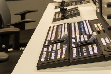 Video switcher of Television Broadcast with blurry background, working with video and audio mixer, control broadcasts in recording studio