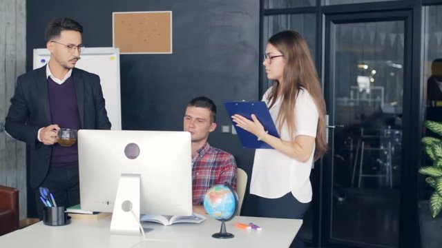 Group of business people working together, meeting and brainstorming in office.