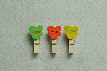 Eight plus ten on a white background