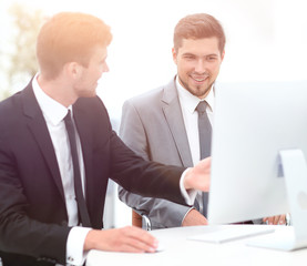 Fototapeta premium employees are talking sitting behind a Desk