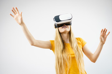 Girl wearing virtual reality goggles.