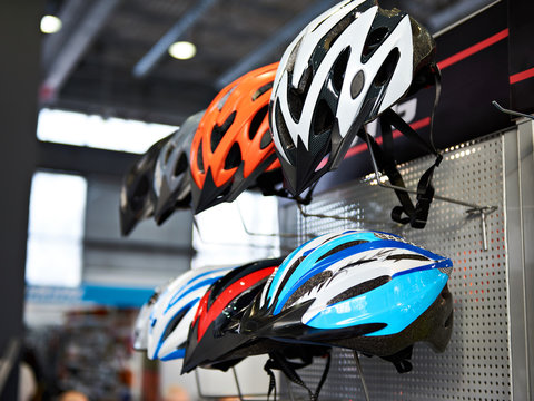 Modern protective sport helmets for cyclists in store