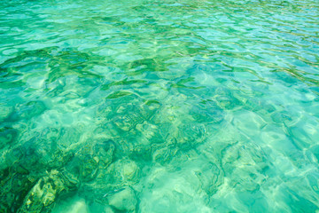 the backdrop of the azure waters on the island of Phi Phi.Thailand