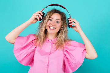 Woman DJ in shirt with headphones