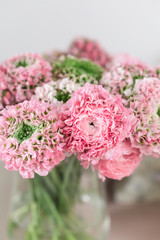 Persian buttercup. lace with many petals. Bunch pale pink ranunculus flowers light background. Wallpaper