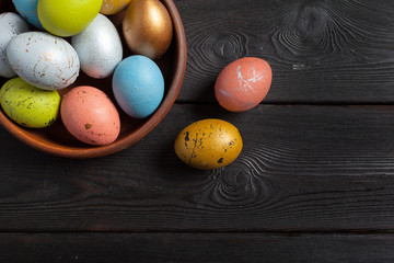 Happy easter! Easter eggs on wooden background