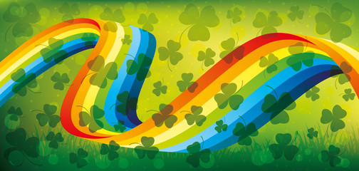 Rainbow and shamrocks  on a green background for St. Patrick's day.