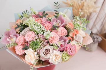 Close-up beautiful luxury bouquet of mixed flowers in glass vases. the work of the florist at a flower shop. Wallpaper