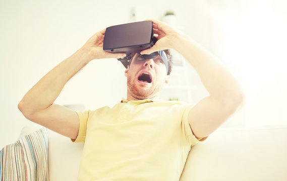 young man in virtual reality headset or 3d glasses