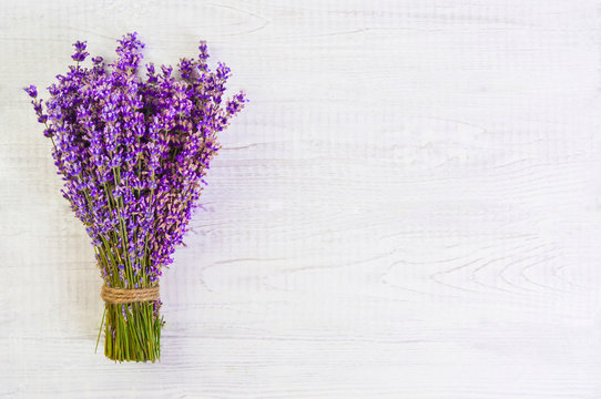 fresh lavender flowers on white wood table background free space