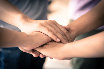 business has hands stacked together.