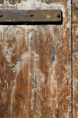 Old wood door with rusty hinge background