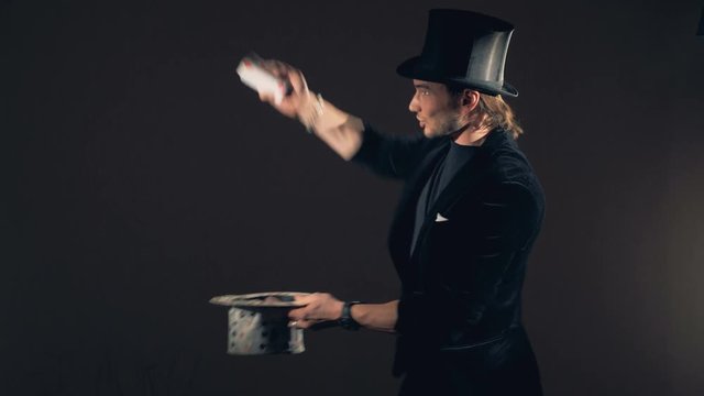 Magician perfoming a card trick.
