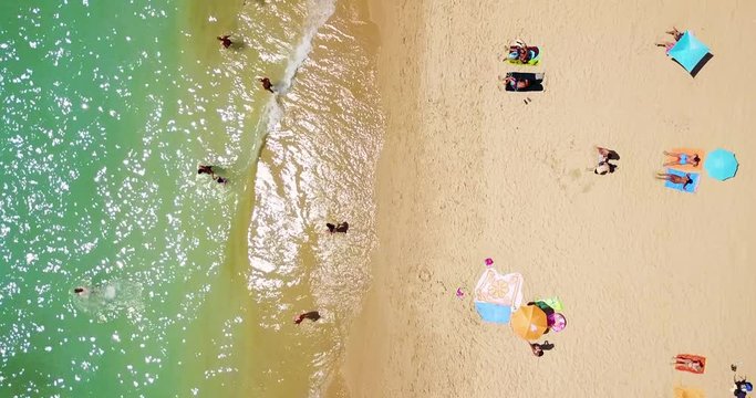 Aerial Footage From Flying Drone Of People Crowd Relaxing On Beach In Portugal