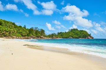 beautiful paradise beach anse bazarca. white sand,turquoise water,palm trees, granite rocks, seychelles