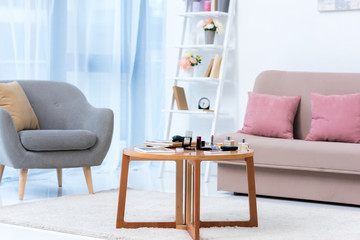 modern stylish interior and various cosmetics on table