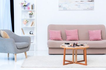 cozy stylish interior and various cosmetics on table