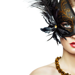 Beautiful young Woman in Mysterious Black Venetian Mask. Fashion photo. Masquerade Mask with Black Feathers - obrazy, fototapety, plakaty