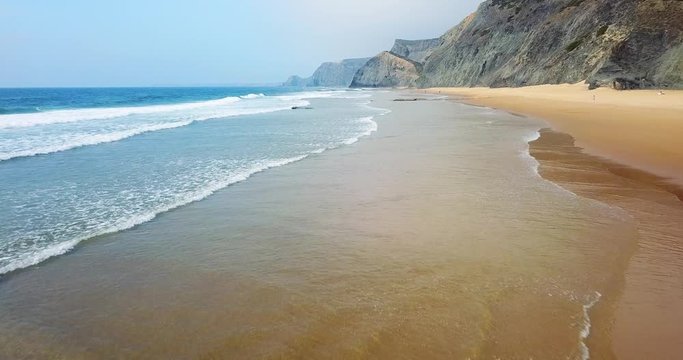 Aerial Footage From Flying Drone Of Ocean Waves And Beautiful Beach In Algarve, Portugal