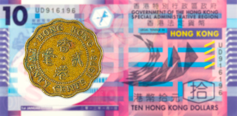 20 hong kong cent coin (1975) against 10 hong kong dollar bank note obverse
