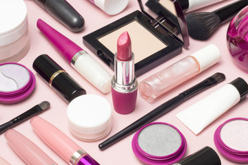 Set of makeup cosmetics, brushes, concealer and other essentials on pink background - 193248030
