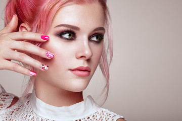 Blonde Girl with Elegant and shiny Hairstyle. Beautiful Model Woman with Curly Hairstyle. Care and Beauty Hair products. Nails and Manicure