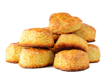 pile of homemade English cheese buns scones on white background