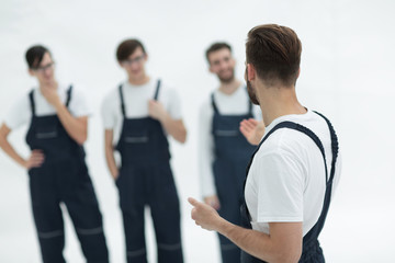 cheerful team of responsible movers and their smiling leader.