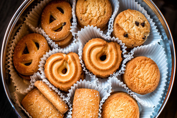 Some shortbread cookies in a round box background. Sugar bakery. Sweet snacks. Home pastry.