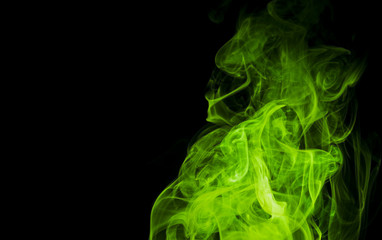 Green smoke on black background