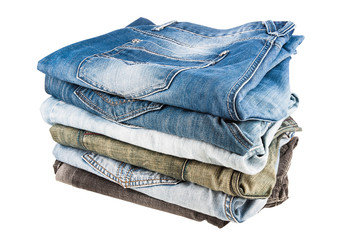Stack of folded clothes, blue jeans pants, dark blue denim trousers