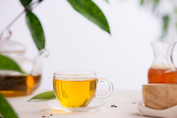 Cups of tea on wooden table background