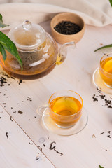 Obraz na płótnie Canvas Cups of tea on wooden table background