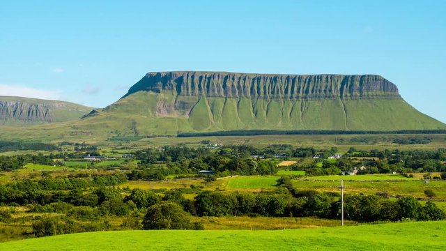 Sligo, Ireland. Panoramic view of Benbulbin mountains during the sunny day with landscape in Sligo, Ireland. Time-lapse with moving clouds. Zoom in
