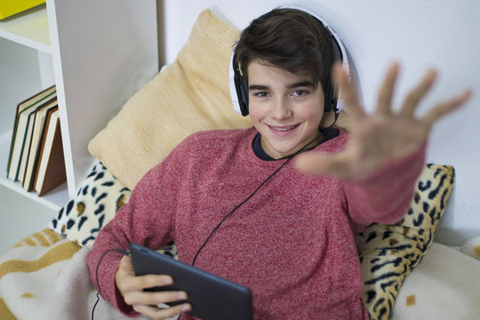 casual young man with tablet at home