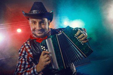 The actor plays the accordion.
