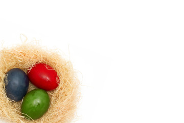 Painted Easter Eggs In Nests isolated on a white background and text space